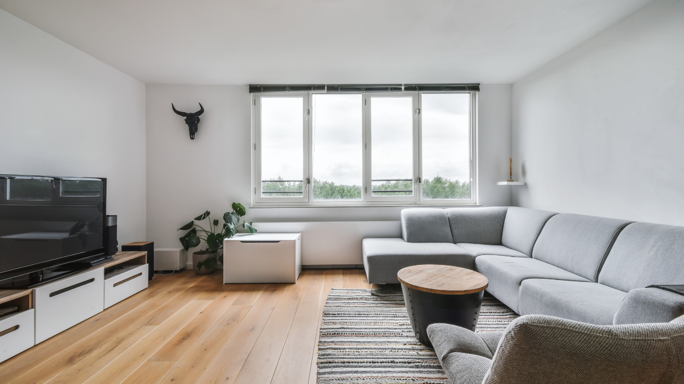 Layered window treatments in a calm Dubai interior